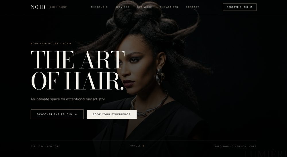 NOIR Hair House homepage hero: the headline The art of hair. over a portrait of a woman with sculpted hair, with Discover the studio and Book your experience buttons